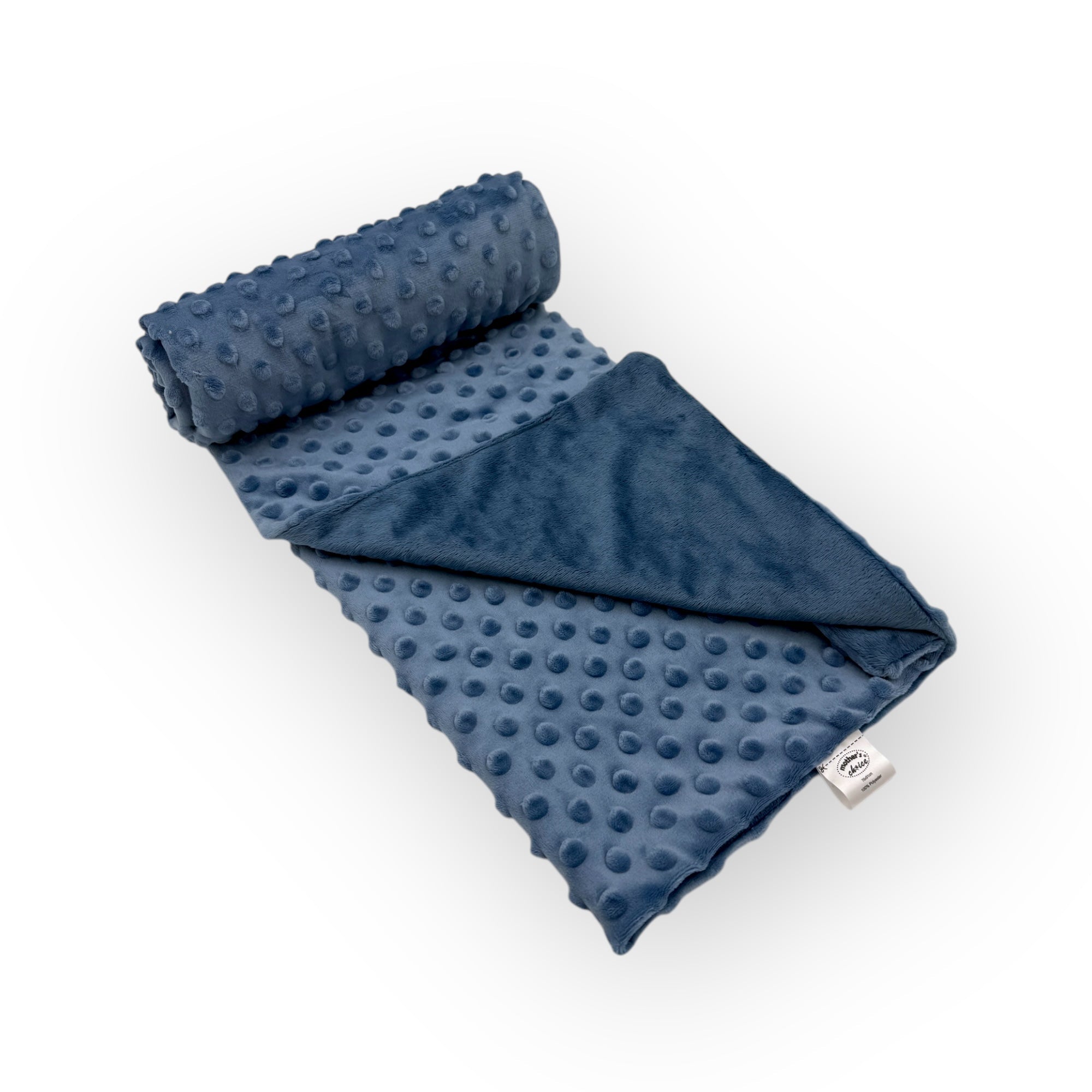 Blue textured blanket rolled up on a white background