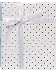 Three polka dot gift boxes in blue, white, and pink with ribbons.
