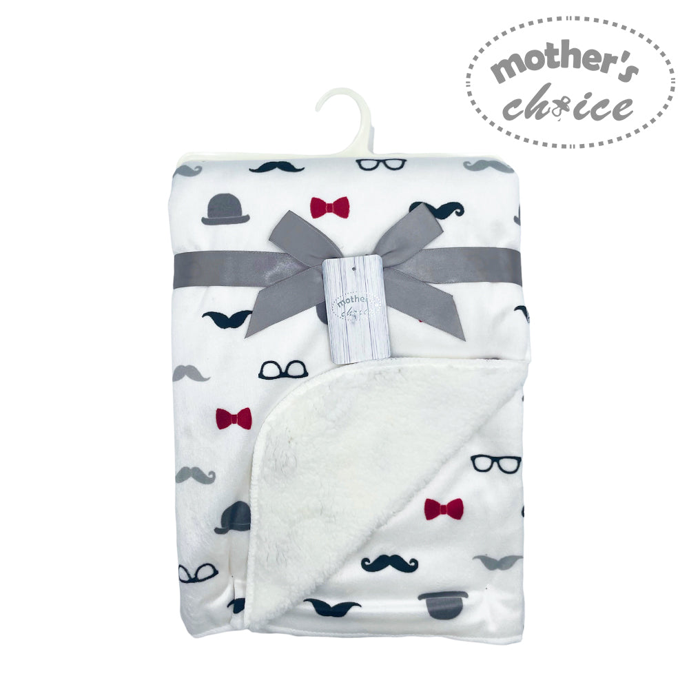Baby blanket with bow tie and mustache pattern on a white background, branded 'Mother's Choice'.