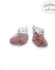 Pair of baby socks with pink cuffs on a white background, branded 'Mother's Choice'.
