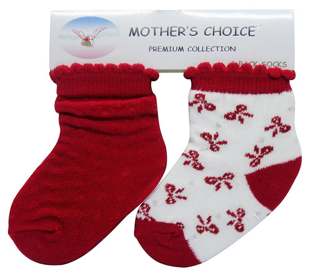 Red and white baby socks with floral pattern on a 'Mother's Choice' branded card.