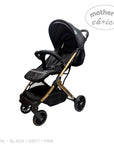 Black stroller with gold accents on a white background, featuring 'Mother's Choice' branding.