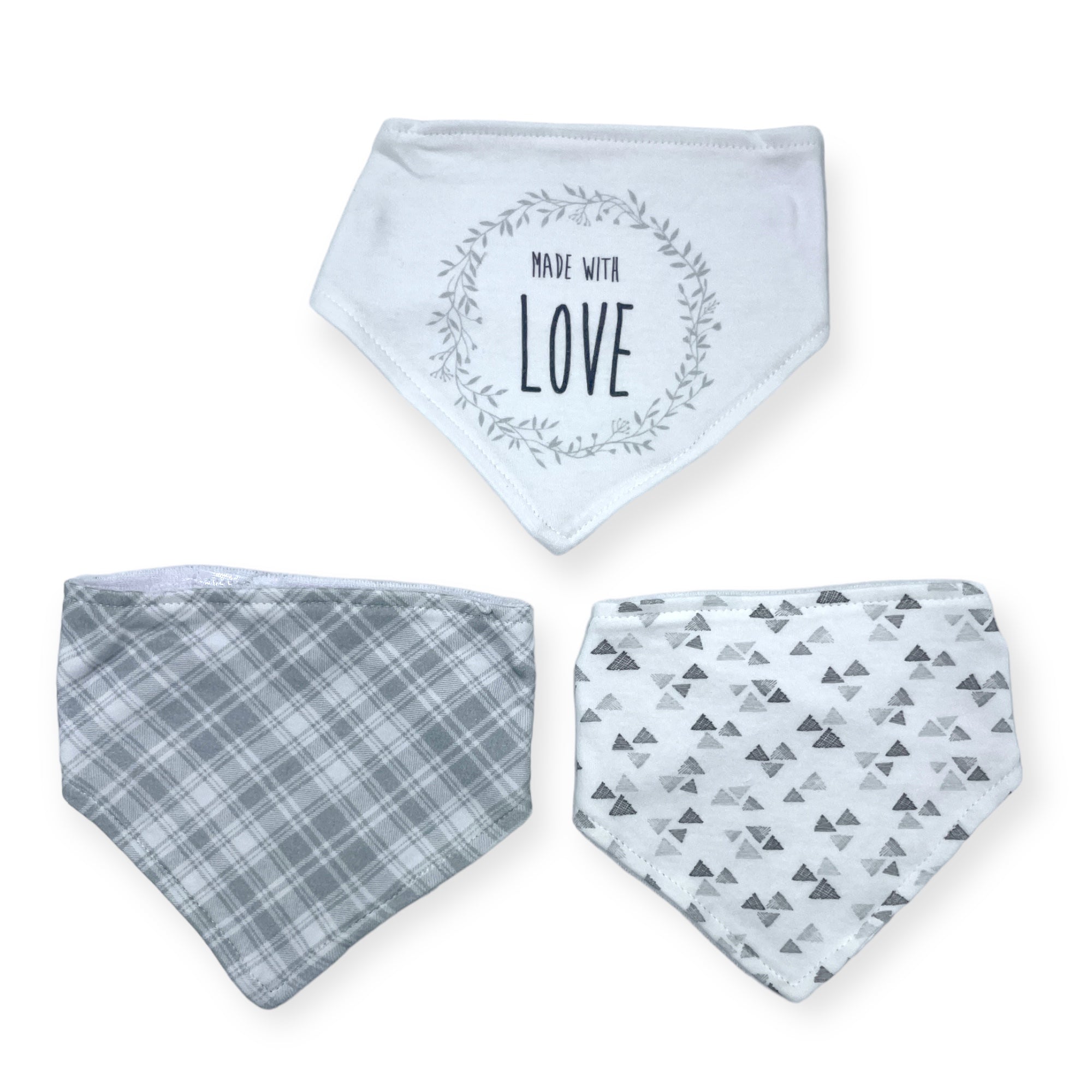 Three baby bibs with different patterns on a white background