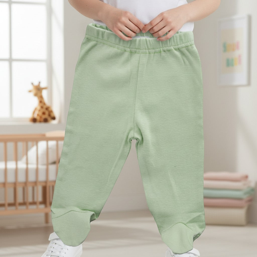 Stork And Baby apple green 100% cotton footed baby leggings with elastic waistband.