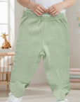 Stork And Baby apple green 100% cotton footed baby leggings with elastic waistband.