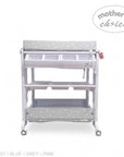 Stork And Baby baby bath caddy with grey and white star pattern, featuring storage compartments and rolling wheels