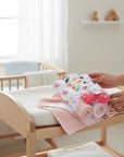 Stork And Baby 3 pack of soft baby hooded towels and whale toys in pink and white with sea creature patterns