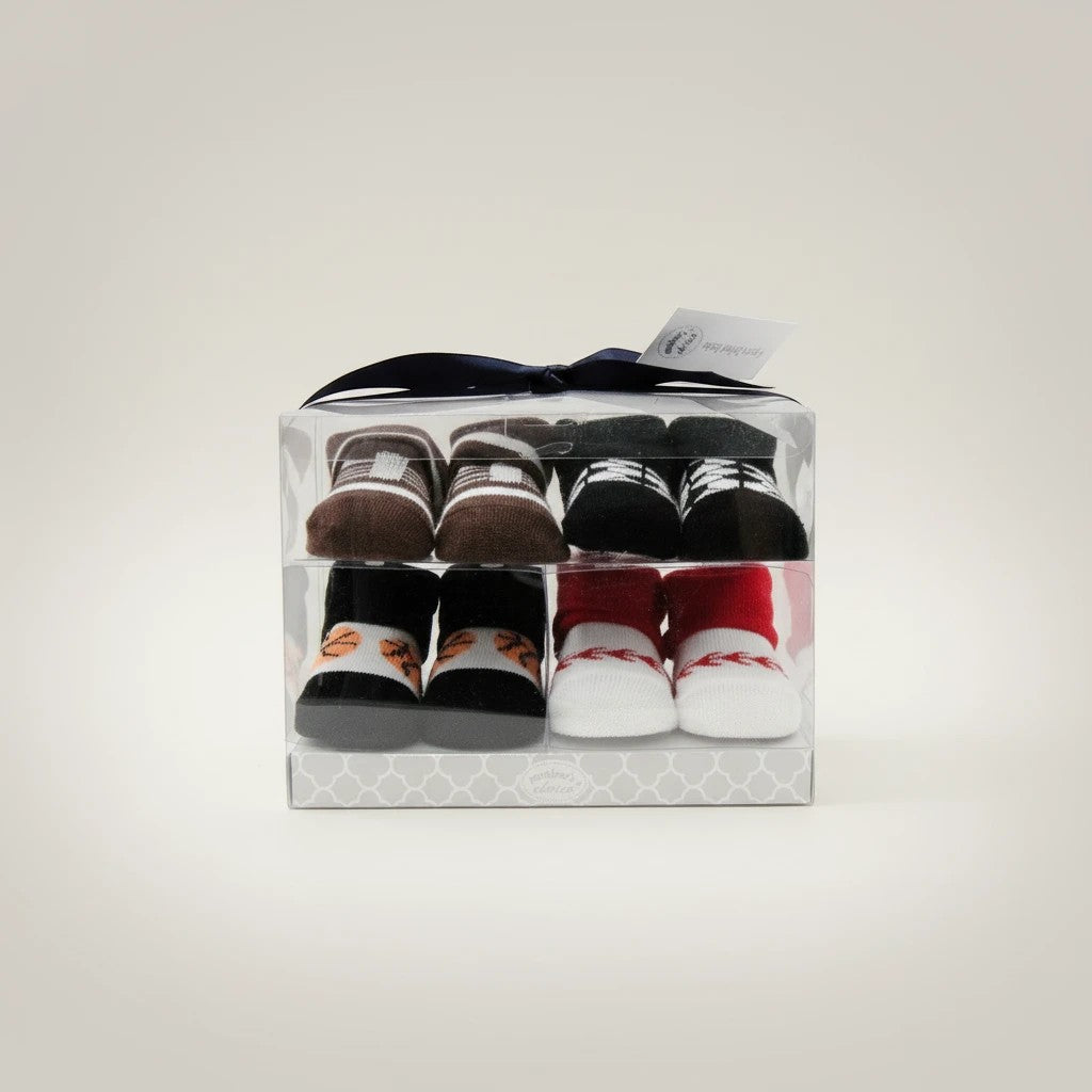 Stork And Baby 4 pack baby socks in PVC gift box featuring brown, black, and white designs with basketball and red accents.