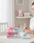 Stork And Baby 4 pack baby socks gift set with owl theme, pink, mint green, and grey colors. Soft cotton blend.