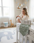 Stork And Baby 2 pack reversible bandana bibs in white with stars and green with moons and stars.