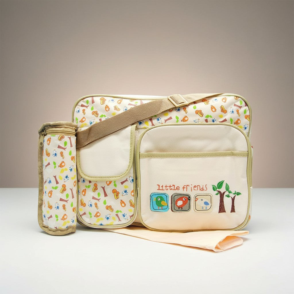 Stork And Baby beige diaper bag with a playful 'Little Friends' bird and tree print, featuring multiple pockets and a matching bottle holder.
