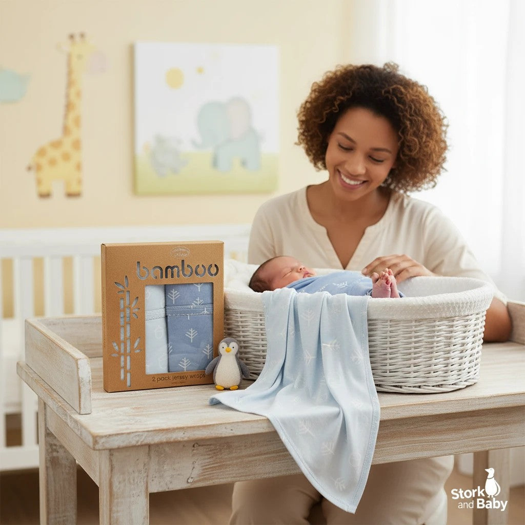 Stork And Baby blue bamboo cotton jersey wraps, 2 pack, 80x80cm, with tree pattern. A mother smiles at her baby.