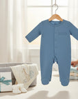 Stork And Baby blue 100% cotton interlock baby grow with snap closure and footies. Features embroidered 'basics' logo.