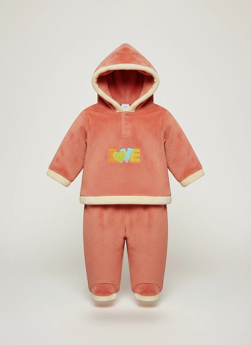 Stork And Baby coral fleece tracksuit with "Love" embroidery and cream trim. Cozy hooded set for girls.