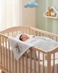 Stork And Baby 100% cotton baby blanket with stars and a rabbit graphic, perfect for newborns.