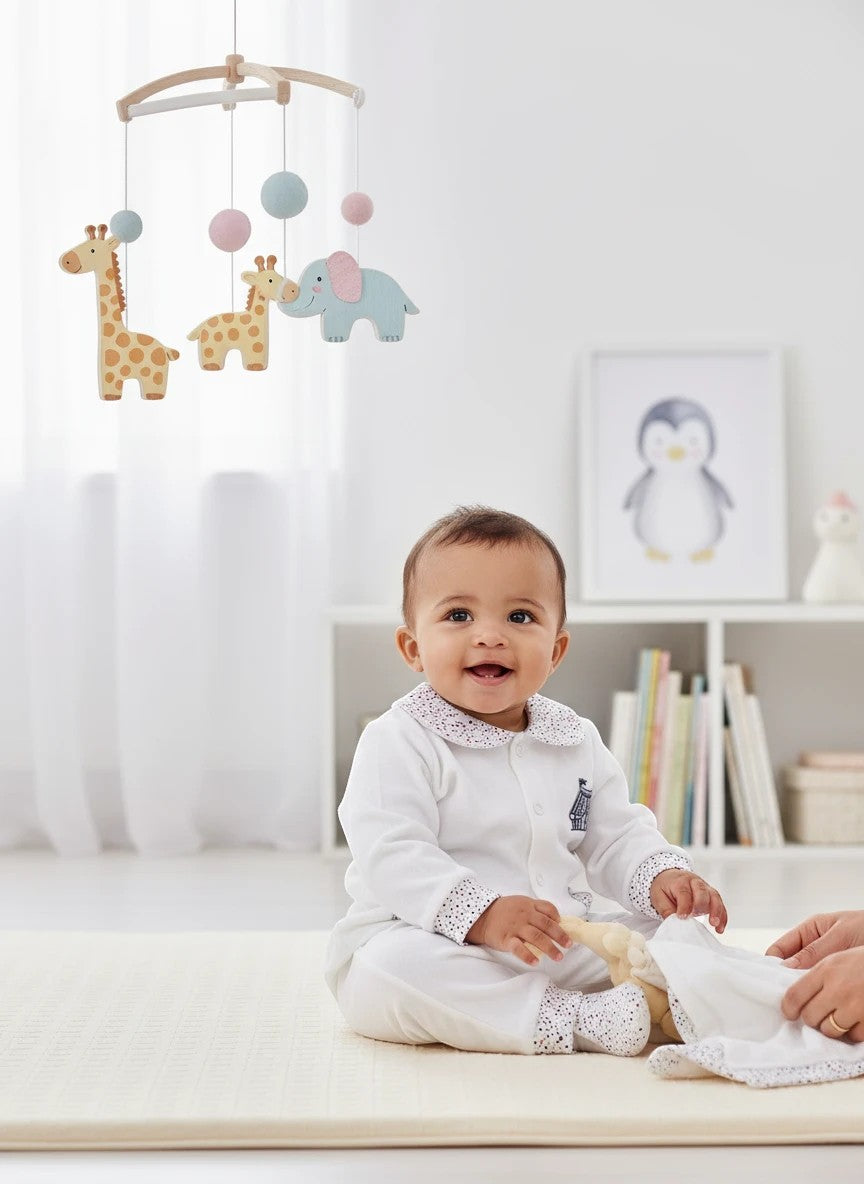 Stork And Baby white 100% cotton long sleeve baby set with a patterned collar and cuffs.