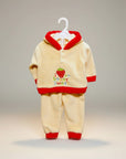 Stork And Baby cream coral fleece tracksuit with red trim and strawberry embroidery. Hooded.