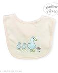 Stork And Baby light peach cotton interlock bib with embroidered ducks and a mushroom.
