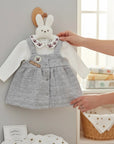 Stork And Baby grey quilted pinafore dress with white long-sleeve top, bee embroidery on collar.