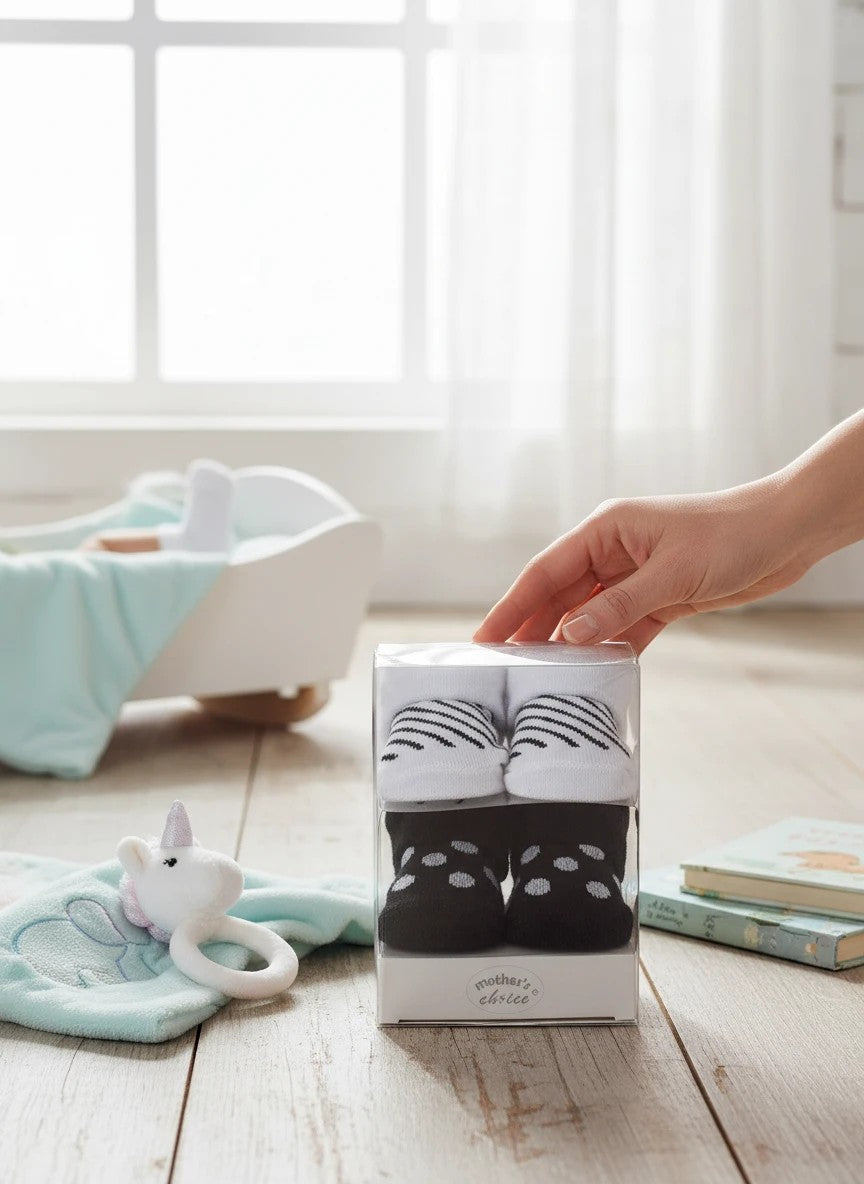 Stork And Baby Mothers Choice Girls 2 Pack Socks Gift Pack, white with black stripes and black with white polka dots.