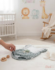 Stork And Baby green floral cotton linen romper with white lace trim and ruffle sleeves. Baby outfit with booties.