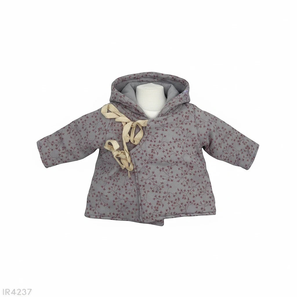 Stork And Baby grey fiber jacket with a floral print and cream ribbon tie closure. Hooded design for warmth.