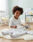 Stork and Baby grey padded velour baby grower with bicycle detail and gingham collar and cuffs.