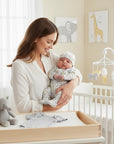 Stork And Baby 5 piece Grey Zoo starter pack: bodysuit, hat, mittens, grower, and bib. Soft cotton with animal print.