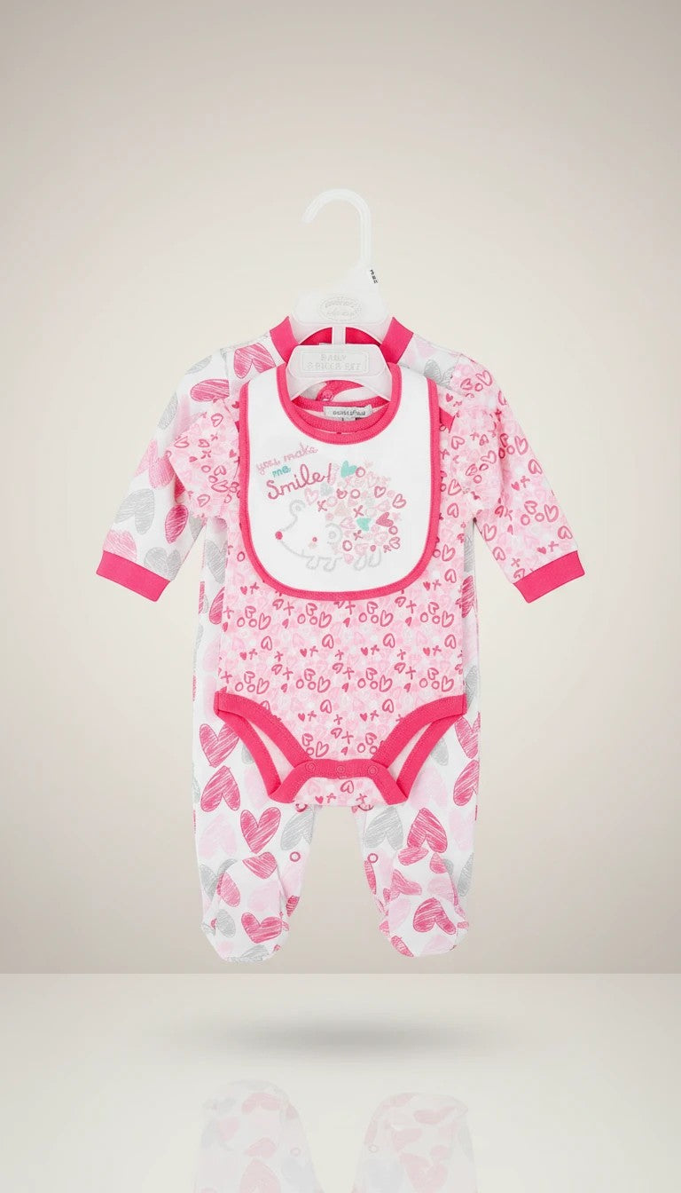 Stork And Baby pink and white heart print 3-piece infant starter set with footed onesie and bib.