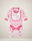 Stork And Baby pink and white heart print 3-piece infant starter set with footed onesie and bib.