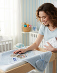 Stork And Baby blue hooded towel and facecloth set with Soccer Bear design, soft and absorbent for baby care.