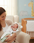 Stork And Baby hooded towel for babies, 100% cotton, white with monkey face and crown detail, light green lining.