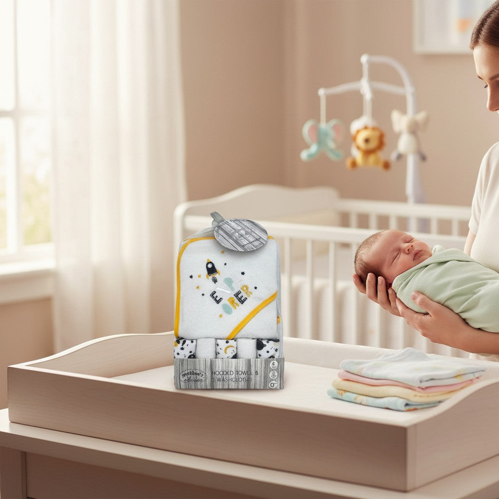 Stork And Baby white hooded towel and 5 washcloths set with rocket and star print, yellow trim.