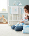 Stork And Baby blue and white polyester mink infant cutwork blanket with house and fence design