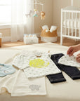 Stork And Baby infants stretch denim set with a white star print top and matching hat, bib, and elephant blanket.
