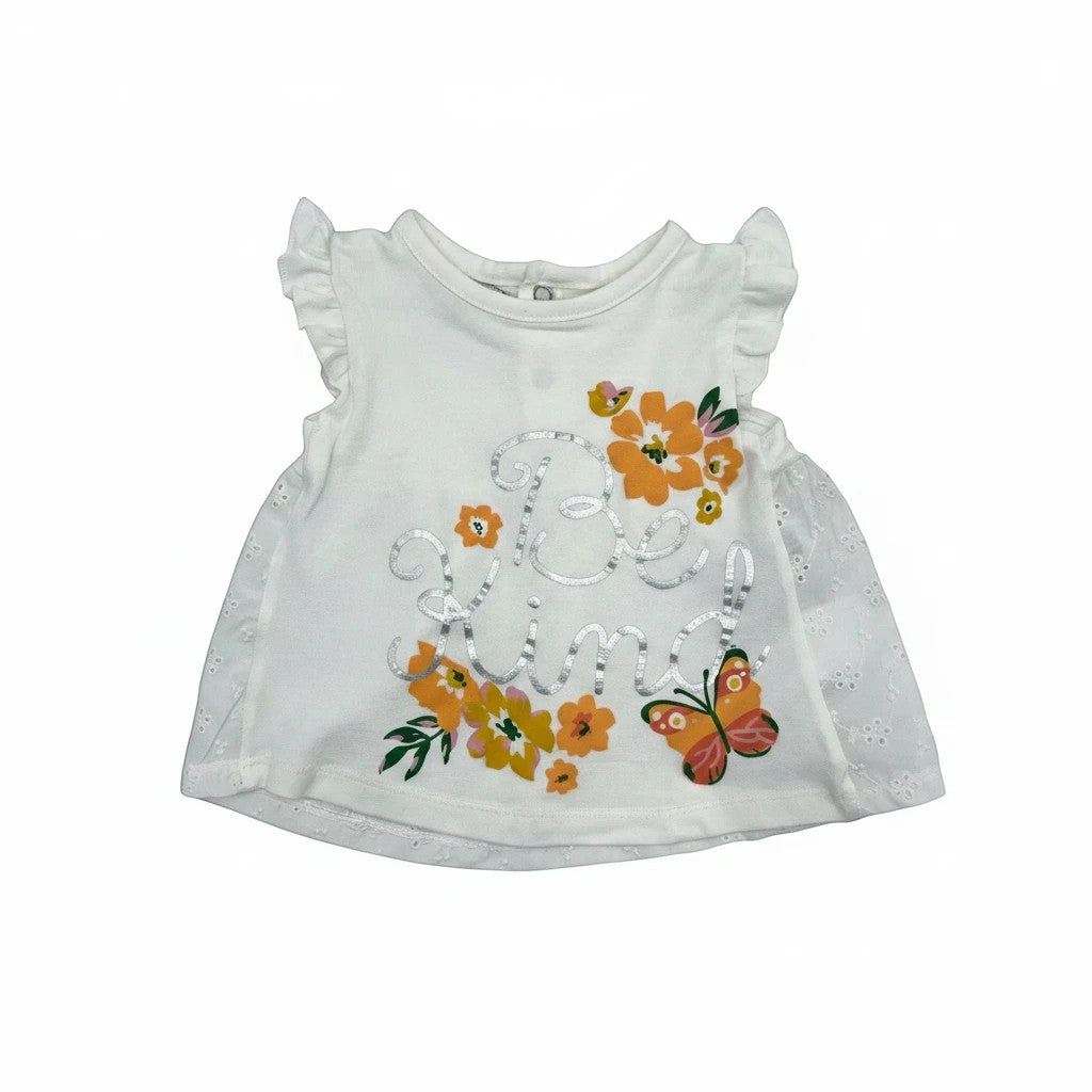 Stork And Baby white cotton infant girls 2-piece set with 'Be Kind' text, floral print, and butterfly detail. Ruffled sleeves and eyelet trim.