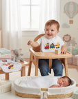 Stork And Baby infants square bib with colorful train embroidery, white cotton, for feeding time.