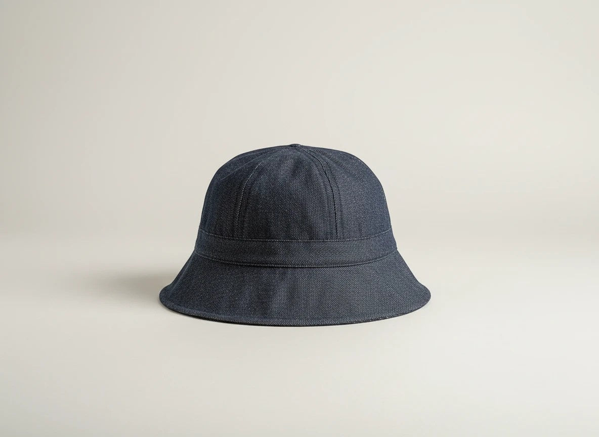 Stork And Baby dark blue denim bucket hat for infants, round plain design with a comfortable fit.