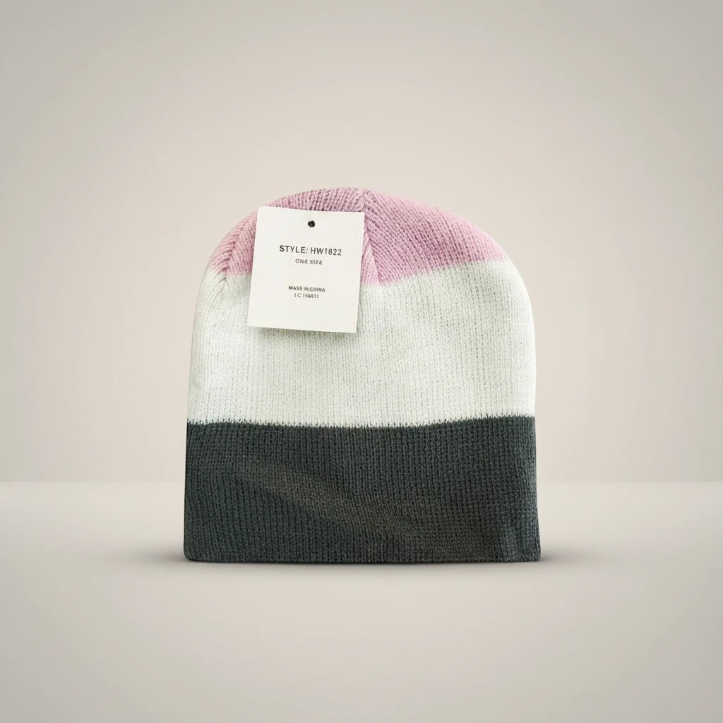 Stork And Baby pink, white, and grey striped knit infants winter hat with a tag.