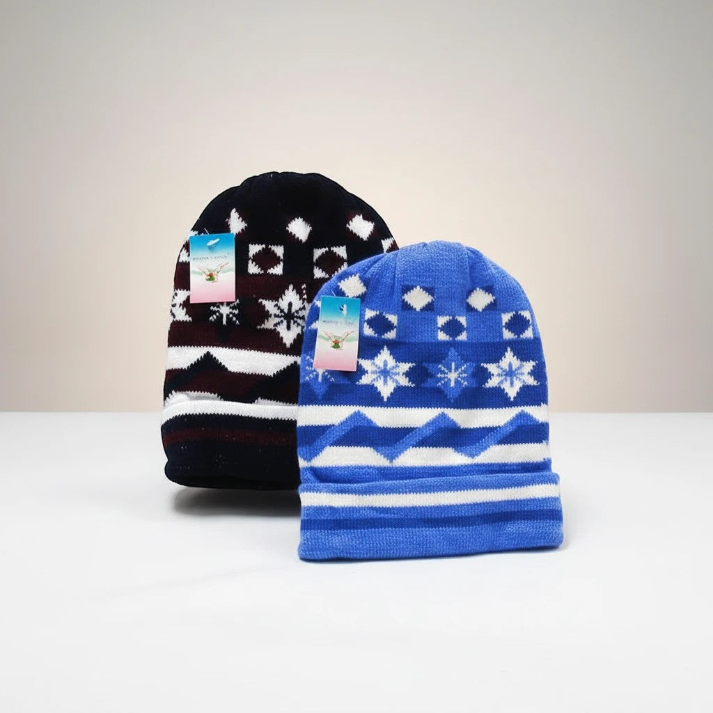 Stork And Baby blue and navy jacquard knit beanies with snowflake and geometric patterns. 2 pack.