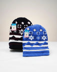 Stork And Baby blue and navy jacquard knit beanies with snowflake and geometric patterns. 2 pack.