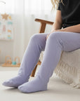 Stork And Baby light blue 100% cotton footed leggings for babies, soft and breathable with a comfortable fit.