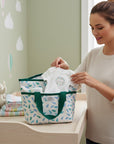 Stork And Baby Mothers Choice Aqua Feather insulated bottle warmer bag with green handles, featuring a feather print.