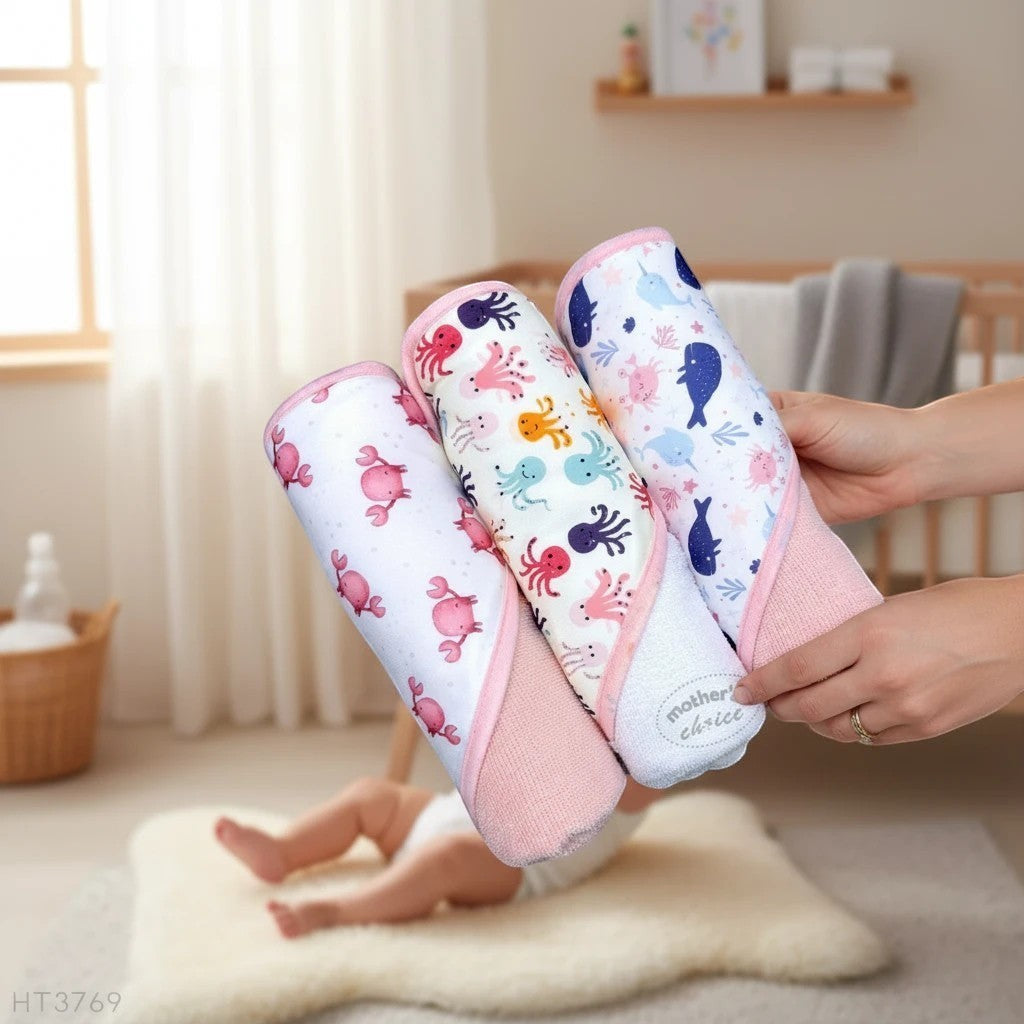 Stork And Baby Mothers Choice 3 pack baby hooded towels featuring colourful whale, crab, and octopus patterns.
