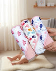 Stork And Baby Mothers Choice 3 pack baby hooded towels featuring colourful whale, crab, and octopus patterns.