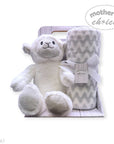 Stork And Baby Mothers Choice baby gift set with a plush white sheep toy and a grey chevron coral fleece blanket.