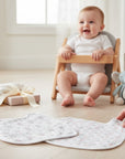 Stork And Baby 2 pack muslin bibs with a delicate pink floral pattern and white trim. Lightweight and breathable.