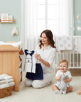 Stork And Baby navy and white 2-piece sailor outfit for boys, featuring a sailboat embroidery.