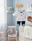 Stork And Baby white and navy sailor 5-piece infant set with hat, pants, and footies. Soft cotton blend.
