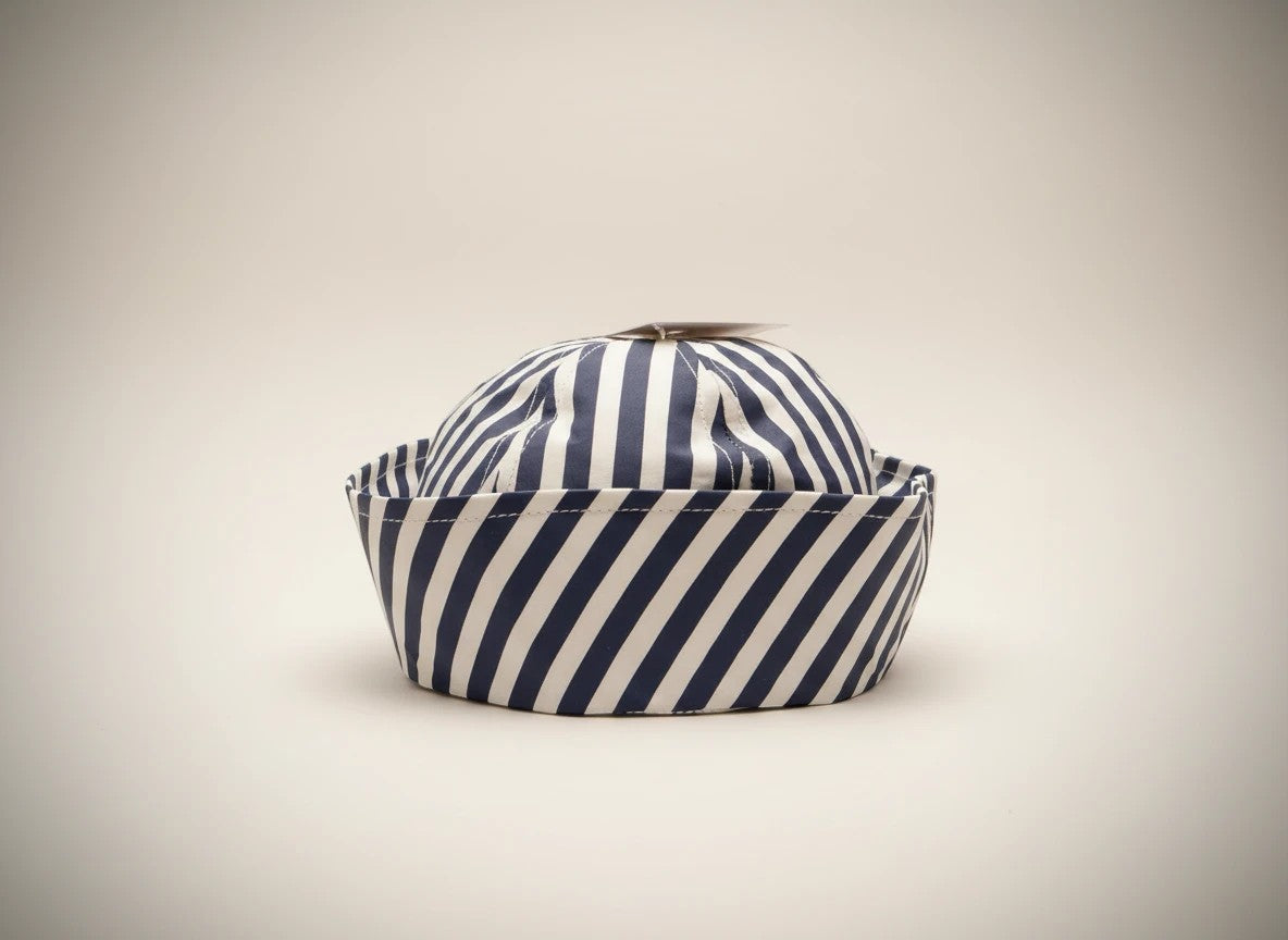 Stork And Baby navy and white striped dough boy hat for infants, soft cotton, classic sailor style.